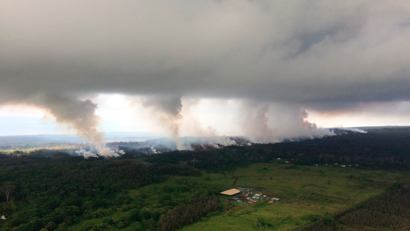 Sulfur dioxide plumes rising from fissures along the rift and accumulating in the cloud deck.